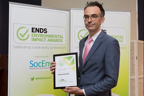 Hub employee holds Sustainability Impact of the Year Award