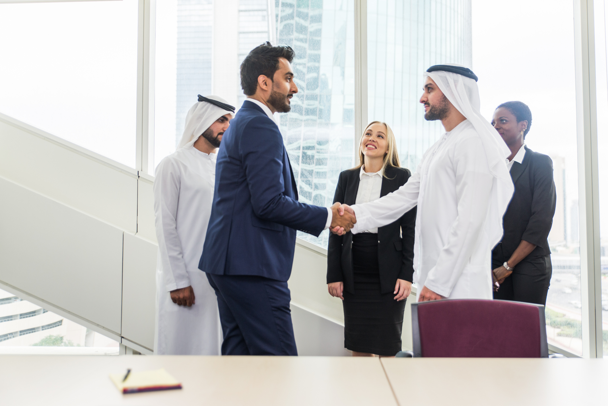 Multiracial group of business people having a meeting in Dubai office